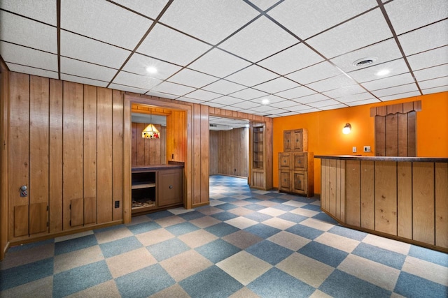 5110 W Cleveland Ave, Milwaukee, WI 53219 - unfurnished room featuring bar, carpet, a drop ceiling, recessed lighting, and wooden walls