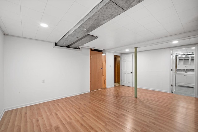 5110 W Cleveland Ave, Milwaukee, WI 53219 - finished basement with light wood-style floors and recessed lighting