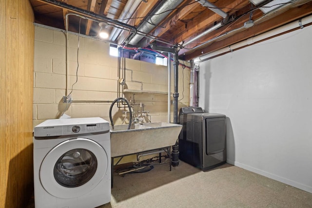 5110 W Cleveland Ave, Milwaukee, WI 53219 - laundry room featuring separate washer and dryer and concrete block wall