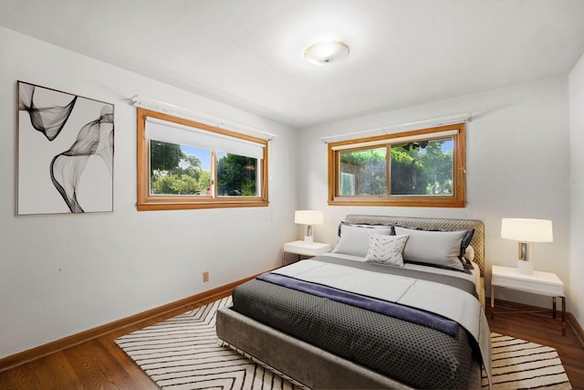 5110 W Cleveland Ave, Milwaukee, WI 53219 - bedroom featuring multiple windows and wood finished floors