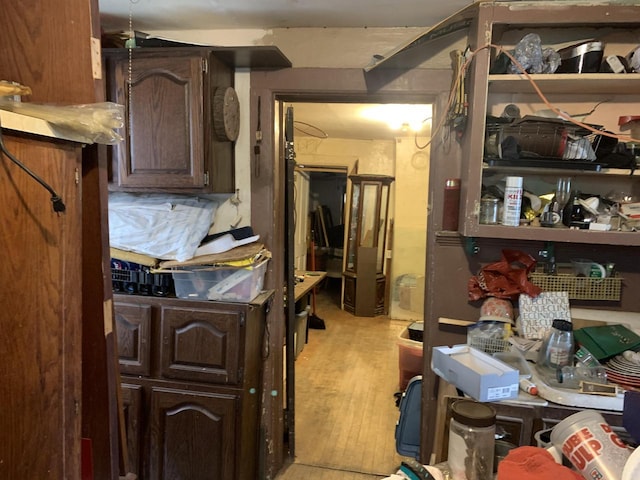3060 N Buffum St Unit 3060A, Milwaukee, WI 53212 - kitchen with dark brown cabinets and light wood-type flooring
