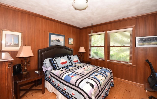 4729 James Ave, Wind Point, WI 53402 - bedroom with wooden walls, wood finished floors, and crown molding