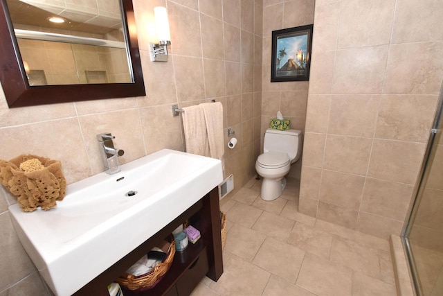 4729 James Ave, Wind Point, WI 53402 - bathroom featuring tile walls, a shower stall, vanity, and tile patterned flooring