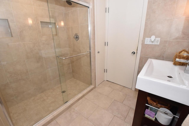 4729 James Ave, Wind Point, WI 53402 - full bathroom with a stall shower, tile walls, vanity, and tile patterned floors
