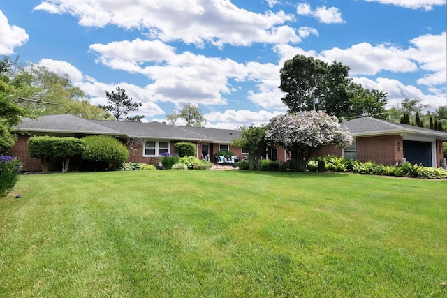 4729 James Ave, Wind Point, WI 53402 - view of front facade with brick siding and a front yard