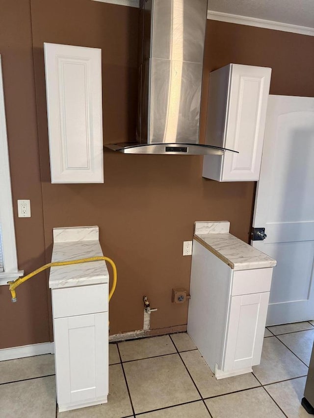 5411 N 37th St, Milwaukee, WI 53209 - laundry area featuring ornamental molding and light tile patterned flooring