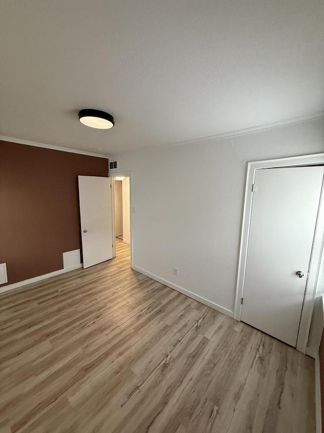 5411 N 37th St, Milwaukee, WI 53209 - unfurnished room with light wood-style flooring and crown molding