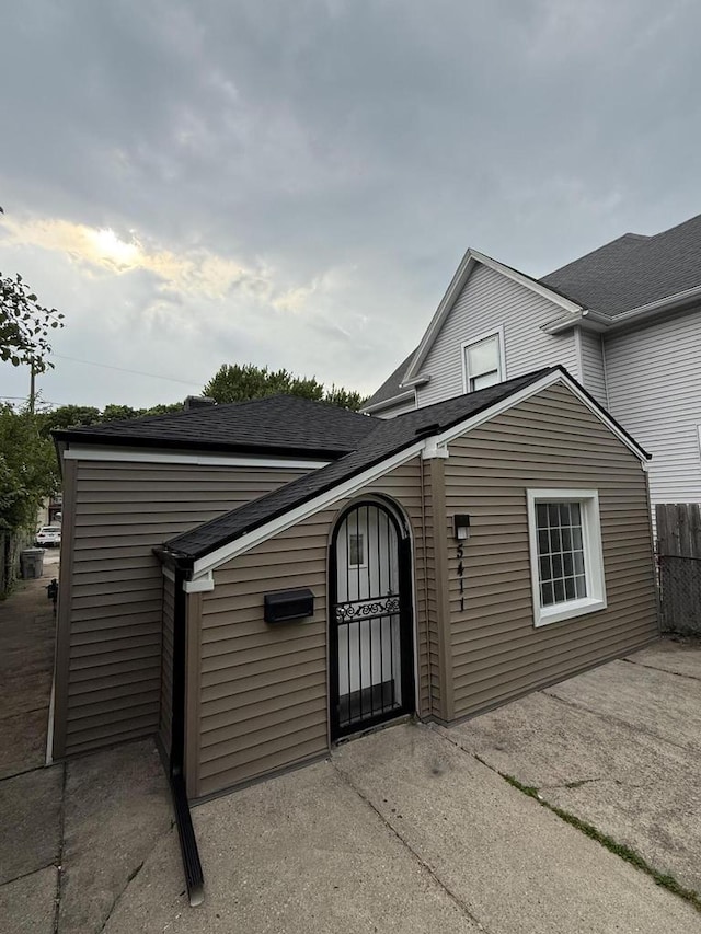 5411 N 37th St, Milwaukee, WI 53209 - view of side of property with roof with shingles