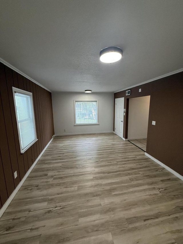 5411 N 37th St, Milwaukee, WI 53209 - unfurnished room featuring light wood-style flooring and ornamental molding