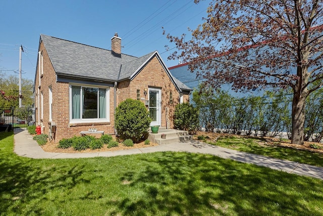 3057 N 90th St, Milwaukee, WI 53222 - view of front facade featuring roof with shingles, brick siding, and a chimney