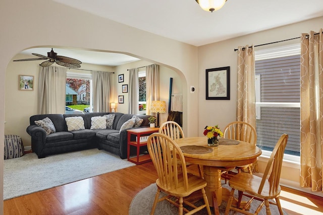 3057 N 90th St, Milwaukee, WI 53222 - dining space featuring arched walkways, wood finished floors, and ceiling fan
