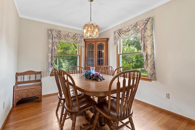 6500 S 121st St, Franklin, WI 53132 - dining area featuring healthy amount of natural light, a chandelier, light wood-style floors, and ornamental molding