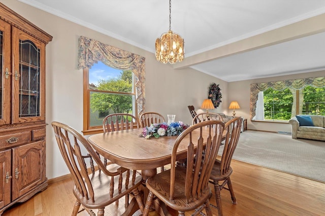 6500 S 121st St, Franklin, WI 53132 - dining area with a chandelier, light wood-style floors, and crown molding