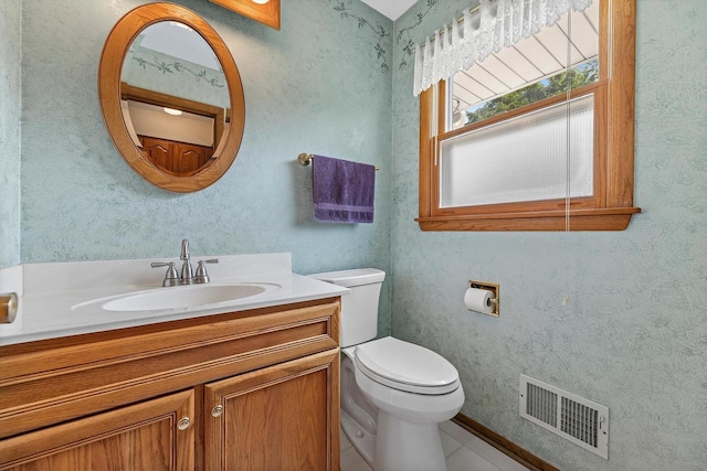 6500 S 121st St, Franklin, WI 53132 - half bath featuring vanity, wallpapered walls, and tile patterned flooring