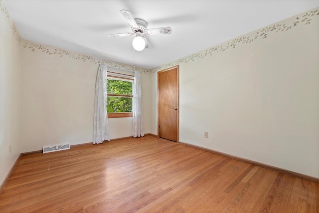 6500 S 121st St, Franklin, WI 53132 - spare room with light wood finished floors and a ceiling fan