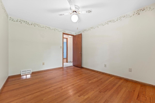 6500 S 121st St, Franklin, WI 53132 - empty room with light wood finished floors and a ceiling fan
