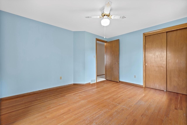 6500 S 121st St, Franklin, WI 53132 - unfurnished bedroom featuring light wood-type flooring, a closet, and a ceiling fan