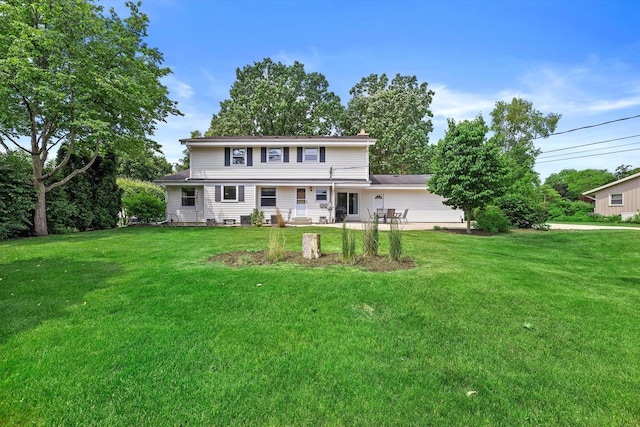 6500 S 121st St, Franklin, WI 53132 - rear view of house featuring a lawn