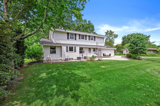 6500 S 121st St, Franklin, WI 53132 - back of property with a patio area and a lawn