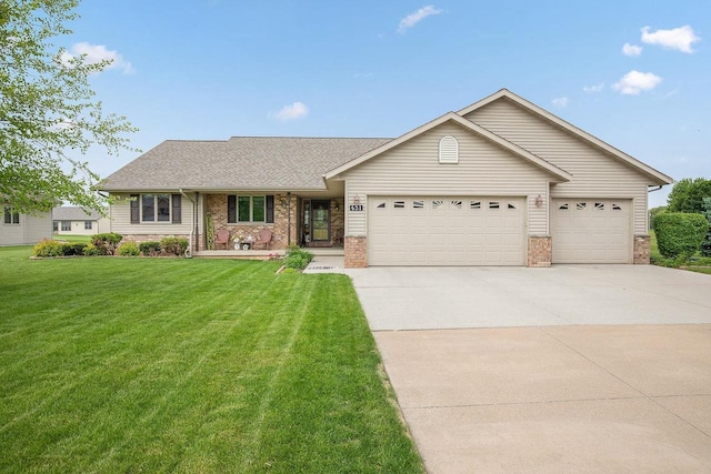 431 Ridgeway Dr, Brillion, WI 54110 - single story home featuring an attached garage, brick siding, driveway, and a front lawn