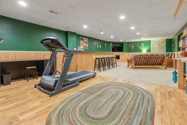 431 Ridgeway Dr, Brillion, WI 54110 - exercise area with wood finished floors, wooden walls, a drop ceiling, and recessed lighting