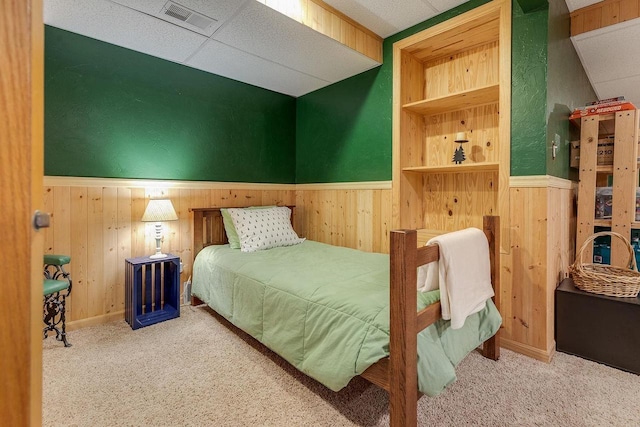 431 Ridgeway Dr, Brillion, WI 54110 - bedroom featuring wood walls, wainscoting, and carpet flooring