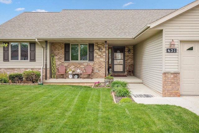 431 Ridgeway Dr, Brillion, WI 54110 - view of front of home with covered porch, roof with shingles, brick siding, and a front lawn