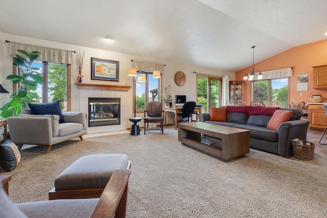 431 Ridgeway Dr, Brillion, WI 54110 - living area with a fireplace, carpet flooring, vaulted ceiling, an office area, and a chandelier