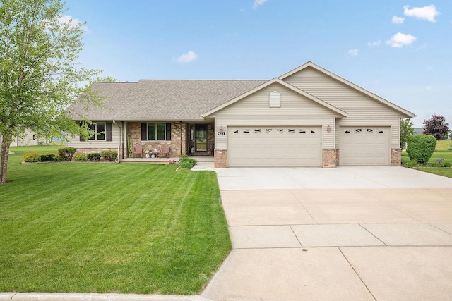 431 Ridgeway Dr, Brillion, WI 54110 - ranch-style house with brick siding, a garage, driveway, a front yard, and roof with shingles