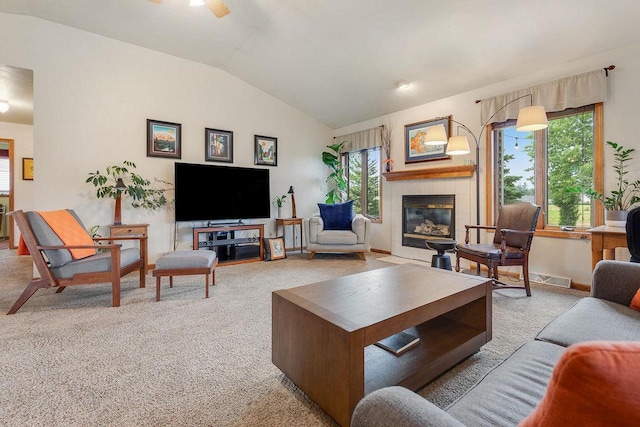431 Ridgeway Dr, Brillion, WI 54110 - carpeted living room with a tiled fireplace, healthy amount of natural light, and vaulted ceiling