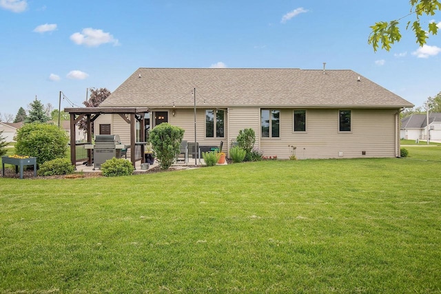 431 Ridgeway Dr, Brillion, WI 54110 - back of property featuring a patio area, a yard, and a shingled roof
