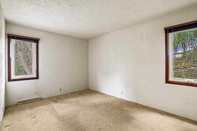 5325 Linden Cir, Racine, WI 53406 - carpeted spare room featuring a textured wall, plenty of natural light, a baseboard radiator, and a textured ceiling