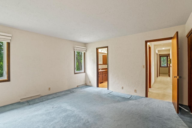 5325 Linden Cir, Racine, WI 53406 - empty room featuring light colored carpet and a textured ceiling