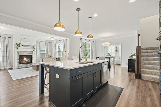 7949 W Oakwood Way, Franklin, WI 53132 - kitchen with dishwasher, light countertops, ornamental molding, dark wood-type flooring, and open floor plan