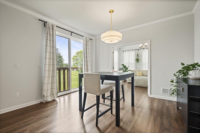 7949 W Oakwood Way, Franklin, WI 53132 - dining space featuring ornamental molding and dark wood-type flooring