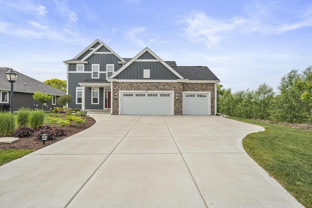 7949 W Oakwood Way, Franklin, WI 53132 - craftsman-style home with board and batten siding, driveway, a garage, stone siding, and a front yard