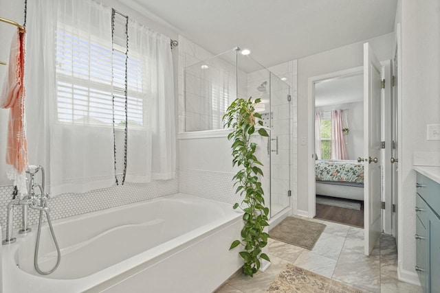 7949 W Oakwood Way, Franklin, WI 53132 - bathroom with a bath, a shower stall, vanity, and marble look tile flooring