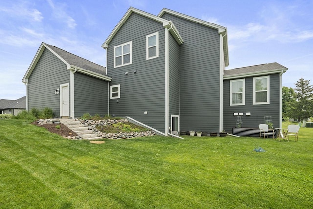 7949 W Oakwood Way, Franklin, WI 53132 - rear view of house featuring a yard