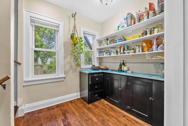 3715 N 2nd St, Milwaukee, WI 53212 - bar area featuring wood finished floors and baseboards