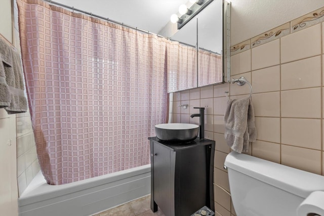 3715 N 2nd St, Milwaukee, WI 53212 - full bathroom with tile walls, shower / tub combo, vanity, and tile patterned flooring