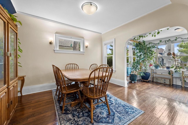 3715 N 2nd St, Milwaukee, WI 53212 - dining room featuring dark wood finished floors and arched walkways