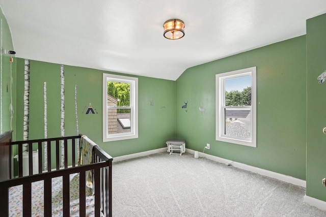 3352 S Adams Ave, Milwaukee, WI 53207 - unfurnished bedroom with multiple windows, carpet flooring, lofted ceiling, and a nursery area