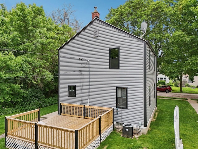 3352 S Adams Ave, Milwaukee, WI 53207 - back of house with a wooden deck, a lawn, and a chimney