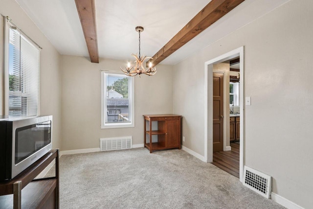 3352 S Adams Ave, Milwaukee, WI 53207 - unfurnished dining area featuring a chandelier, beamed ceiling, and carpet flooring