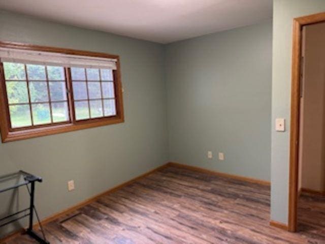 1064 Sunny Ridge Cir, Nekoosa, WI 54457 - unfurnished room with wood finished floors and baseboards