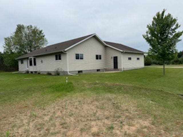 1064 Sunny Ridge Cir, Nekoosa, WI 54457 - view of side of home featuring a yard