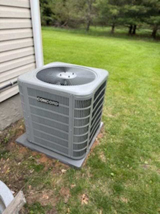 1064 Sunny Ridge Cir, Nekoosa, WI 54457 - exterior view of a central air condition unit