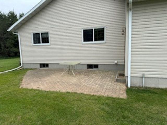 1064 Sunny Ridge Cir, Nekoosa, WI 54457 - back of house with a patio and a yard