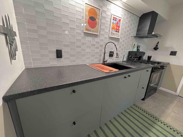 5869 Country Club Rd, Houston, MN 55943 - kitchen with wall chimney range hood, black range with gas cooktop, decorative backsplash, dark countertops, and tile patterned floors