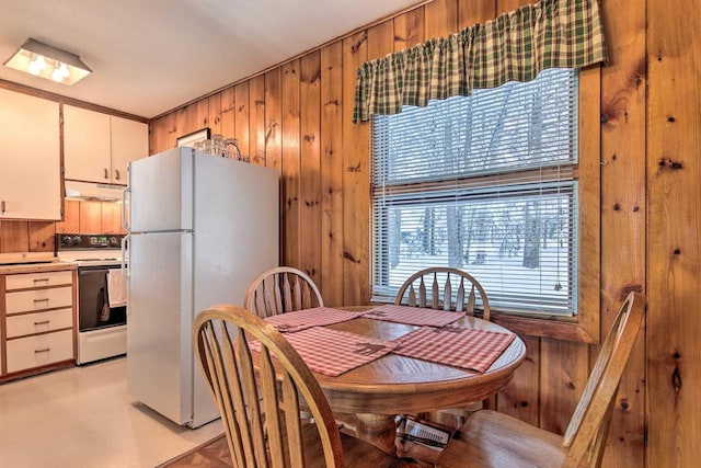 1119 Gross Rd, Woodruff, WI 54568 - dining room featuring wood walls